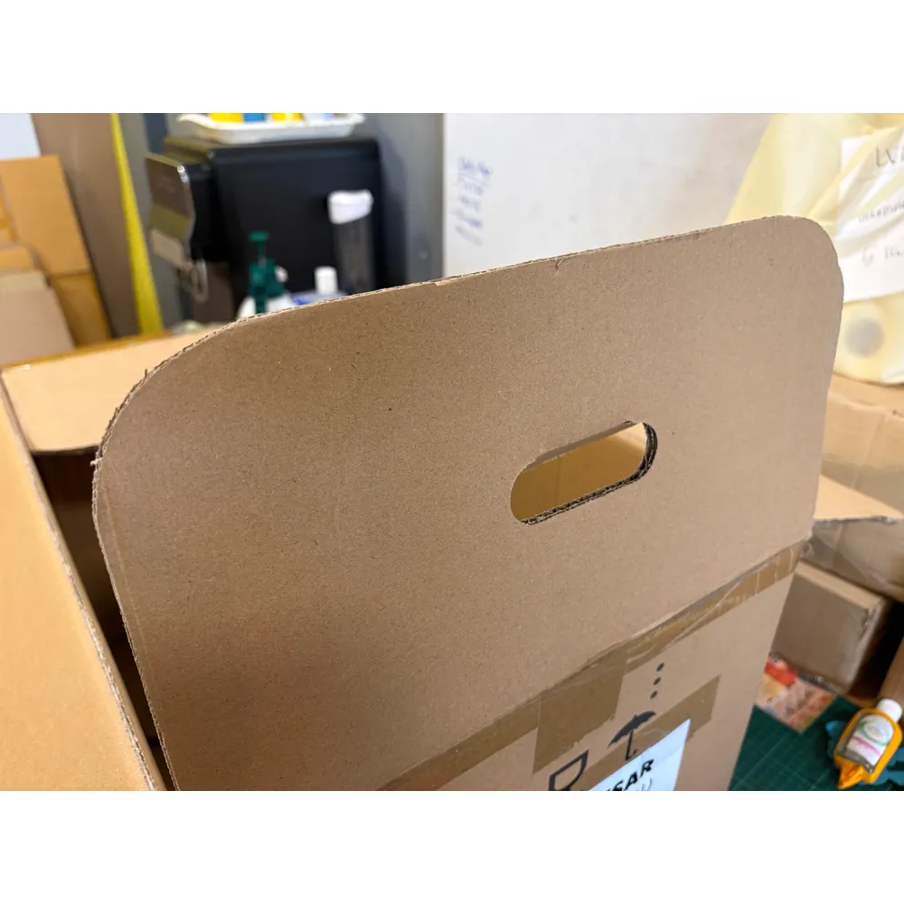 An APT box flap with its cut-out carry handle