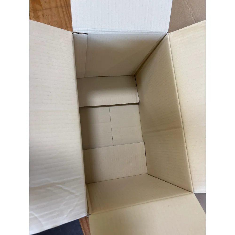 Looking down into the open MG box: plain, clean board inside with the flaps folded out
